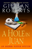 A Hole in Juan by Gillian Roberts